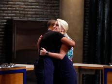 Blue team recruits Lawrence Crawford and Ginny Meerman embrace as Crawford is announced as the blue team winner during elimination as seen on Food Network's Worst Cooks in America, Season 8.