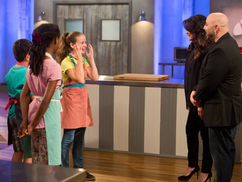 Contestant Rebecca Beale is shocked and emotional as she is named theis season's winner by hosts Duff Goldman and Valerie Bertinelli to announce this season's winner, as seen on Food Network's Kids Baking Championship, Season 2.