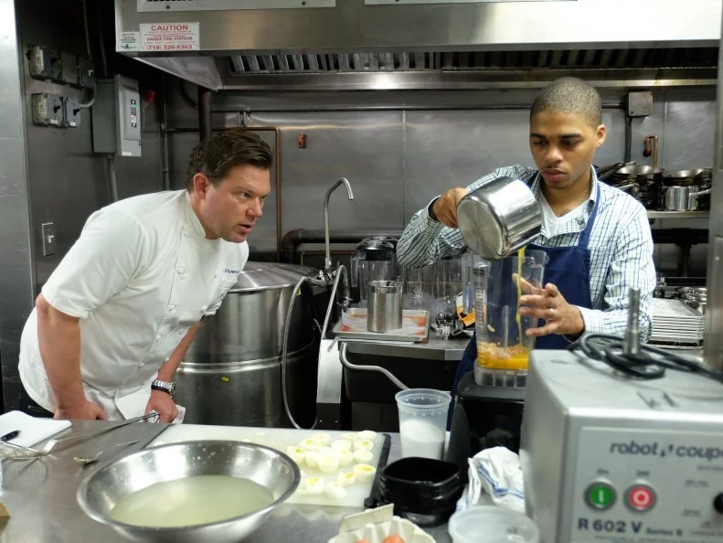 Host Tyler Florence works with finalist, Lawrence Crawford on a menu of béarnaise deviled eggs, osetra caviar, crispy shallots and tarragon; fried chicken, oven roasted ratatouille, and summer corn purée; peach upside down cake with basil ice cream and pistachio cookie crumble, as seen on Food Network’s Worst Cooks In America, Season 8.