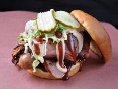 A smokehouse may seem like an unlikely choice for a fine-dining chef, but owner Mike Johnson’s passion for barbecue shines through in dishes like the Big Muddy. The smoky-sweet sandwich comes piled with smoked brisket, jalapeno cheddar sausage and housemade sauces that make for “great layers of flavor,” Michael Symon says.