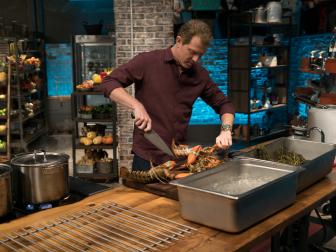 Host Bobby Flay races to finish his Round 2 lobster newburg dish, as seen on Food Network's Beat Bobby Flay, Season 8.