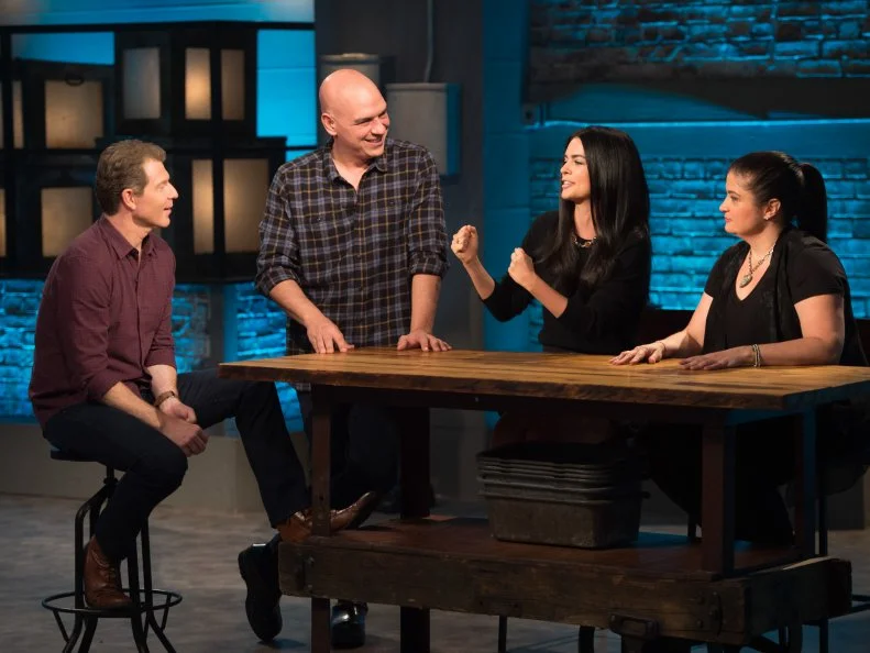 Host Bobby Flay and guest judge Katie Lee with contestants Michael Symon and Alex Guarneschelli, as seen on Food Network's Beat Bobby Flay, Season 8.