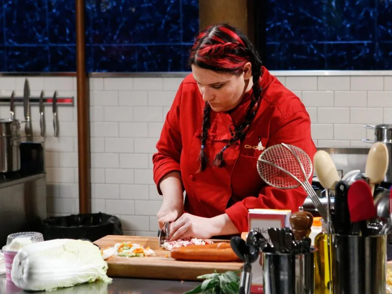 Chef Georgeann Leaming cooks with smoked sausage, cavatappi, Napa cabbage and frozen yogurt during the appetizer round, as seen on Food Network's Chopped, Season 28.