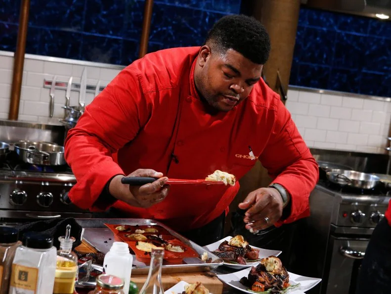 Chef Mo Major cooks with duck breast, harissa, a walnut frangipane tart and orange sherbet during the entree round, as seen on Food Network's Chopped, Season 28.