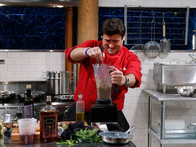 Chef Raffaele Ronca cooks with chicken livers, cinnamon whiskey, edamame and grape licorice during the appetizer round, as seen on Food Network's Chopped, Season 28.