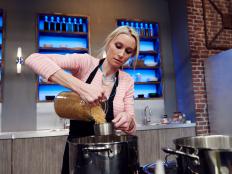 Finalist Melissa Pfeister preparing her dish, Meaty Ricey Burger with Hot Ketchup and Cold Onion, for the Mash Up Star Challenge theme, Cheeseburger and Paella, as seen on Food Network Star, Season 12.