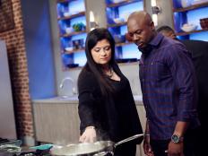 Hosts Alex Guarnaschelli and Eddie Jackson watch Finalist Yaku Moton-Spruill preparing his dish, Sea New York with Dijon Carrot Puree with Jamaican Horchata, for the Stay Trendy challenge, as seen on Star Salvation for Food Network Star, Season 12.