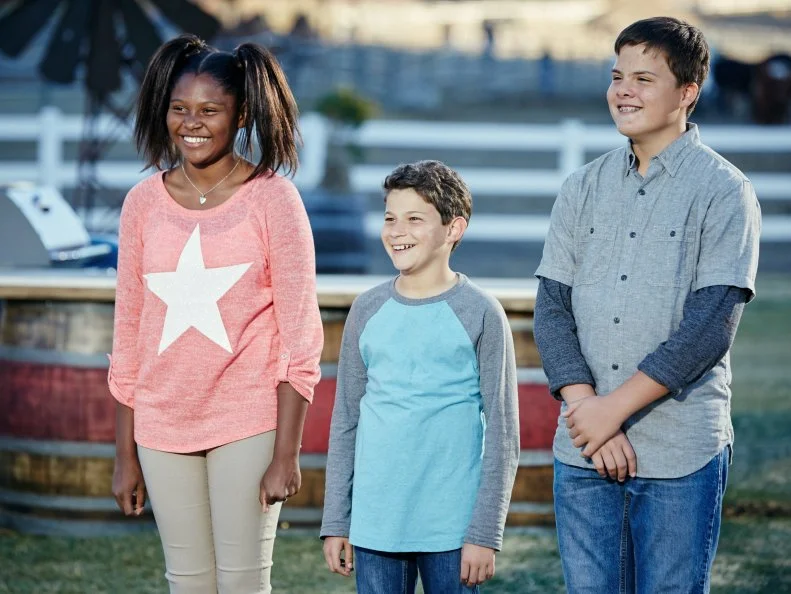 Contestants Paris Hale, Tyler Zager and Carter Hull during deliberation for the Pit Master BBQ Challenge, as seen on Food Network’s Kids BBQ Challenge Season 1.