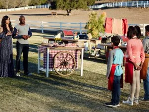 Hosts Eddie Jackson and Camila Alves with Contestants Tyler Zager, Paris Hale, and Carter Hull at the start of the finale, as seen on Food Network’s Kids BBQ Challenge Season 1.