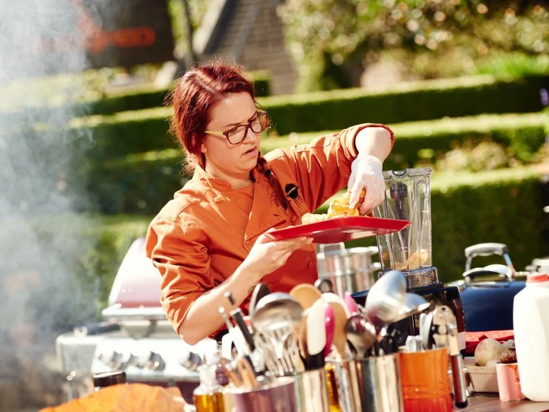 Chef Ashley Pado preparing her Round 2 dish, Southwest Rubbed Grilled Veal Chop with Rustic Smashed Purple Potatoes & Sauce to Finish Smoked Okra, as seen on Food Network's Chopped, Grill Masters Special.
