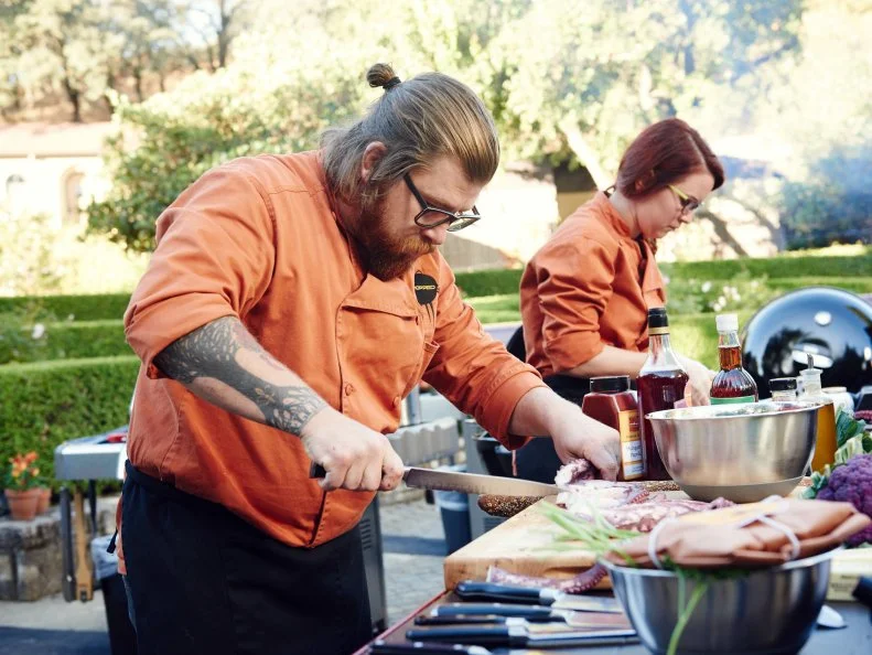 Chefs Jonathan Sawyer and Ashley Pado preparing their dishes for Round 1, as seen on Food Network's Chopped, Grill Masters Special.