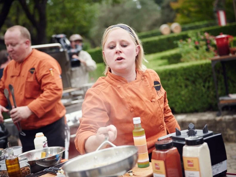 Chefs Christopher Schobel and Karen Mitchell preparing their dishes for Round 2, as seen on Food Network's Chopped, Grill Masters Special.