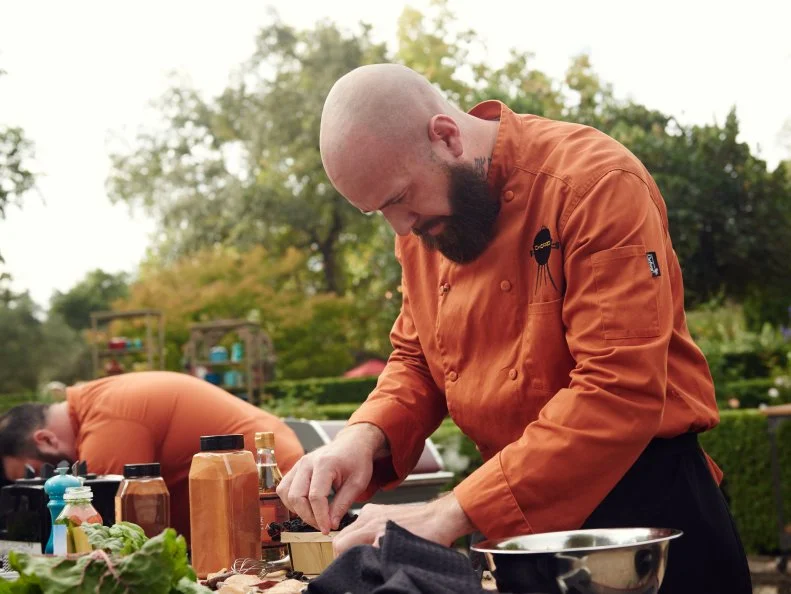 Chef Charles Grund preparing his dish for Round 1, Chili Crusted Abalone with Grilled Chard Salad with Raisin & Spa Water Puree, as seen on Food Network's Chopped, Grill Masters Special.