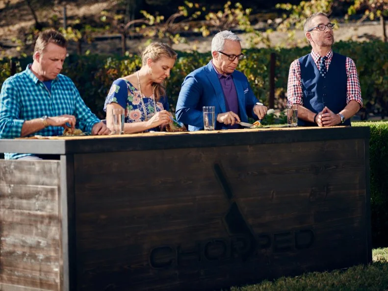 Host Ted Allen with Judges Marc Murphy, Amanda Freitag and Geoffrey Zakarian during Round 1 deliberation, as seen on Food Network's Chopped, Grill Masters Special.