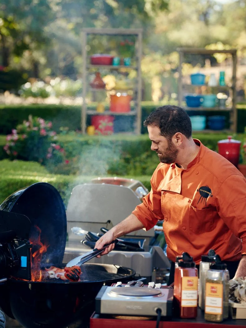 Chef Tony Maws preparing his Round 1 dish, Spice-Crusted and Grilled Tri-tip Steak with Grilled Avocado & Shitake Mushrooms with Red Pepper & Rose Petal Confit Sauce, as seen on Food Network's Chopped, Grill Masters Special.