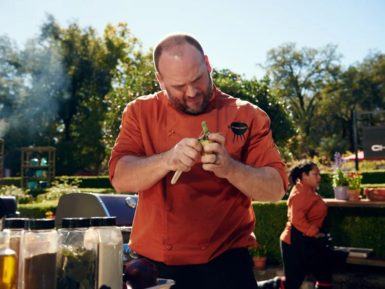 Chef Daniel Gomez Sanchez preparing his Round 2 dish, Garlic Crusted Strip Loin with Razor Clam & Artichoke Sauce, as seen on Food Network's Chopped, Grill Masters Special.