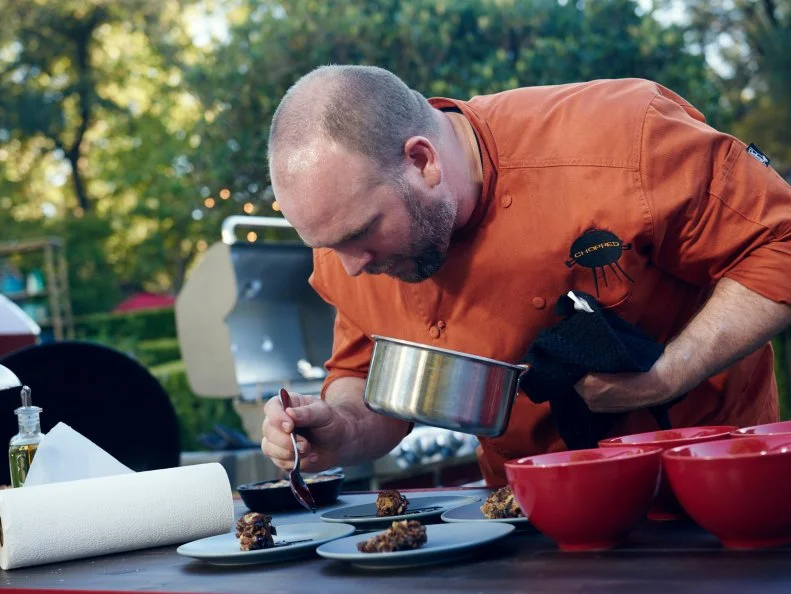 Chef Daniel Gomez Sanchez preparing his dish for Round 3, Babka and Grilled Banana Pain Purdue with Goat Cheese Cream & Red Wine Syrup, as seen on Food Network's Chopped, Grill Masters Special.