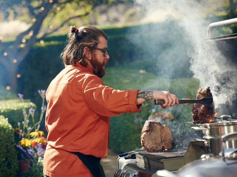 Chef Jonathan Sawyer preparing his Round 2 dish, Bisteca of the Italian Fisherman, as seen on Food Network's Chopped, Grill Masters Special.