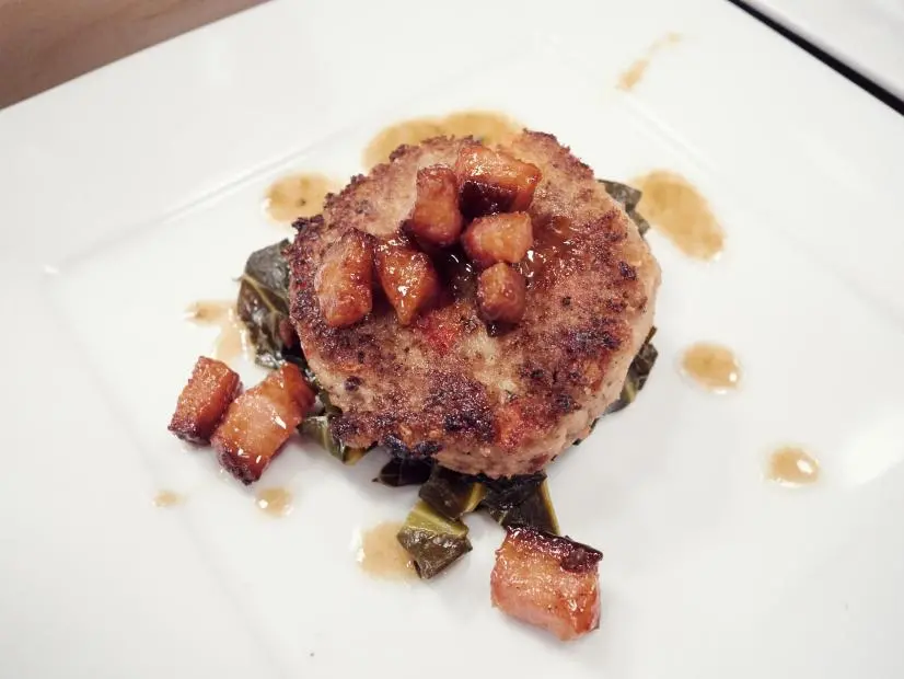 Finalist Tregaye Fraser preparing her dish, Black Eyed Pea Cake, Collard Greens and Brown Sugar Bourbon Pork Belly, for the Star Challenge, Entertaining with Food Stars, as seen on Food Network Star, Season 12.