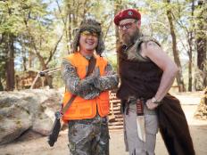 Host Alton Brown and Judge Jet Tila during the Scramble Challenge, as seen on Food Network's Cutthroat Kitchen, Camp Cutthroat Special.