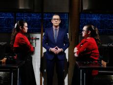 Host Ted Allen stands with teen chefs Eliana de Las Casas, left, and Kamryn Kohler as they face off before the dessert round, as seen on Food Network's Chopped, Season 29.
