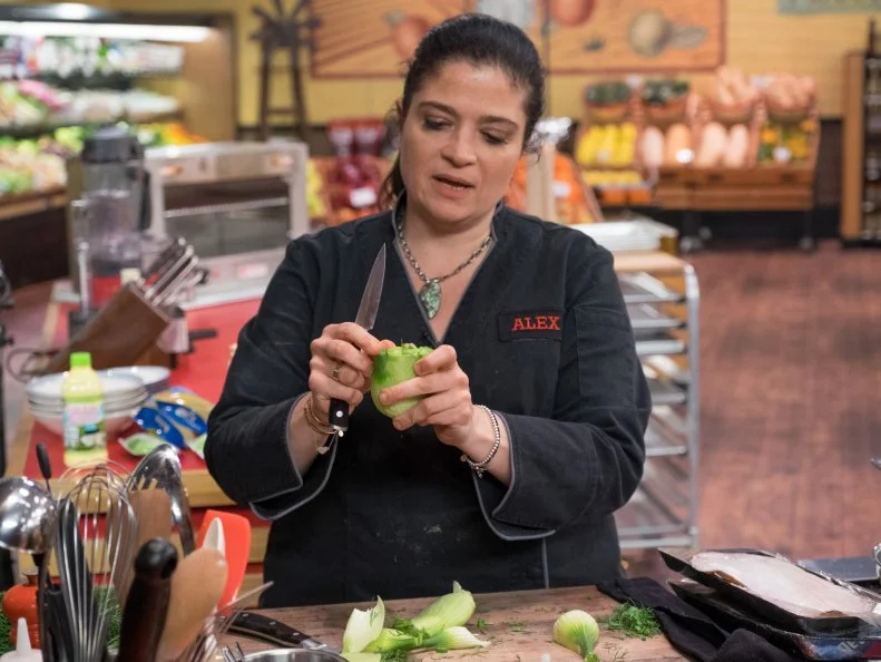 Contestant Alex Guarnaschelli prepares her dish, as seen on Food Network's Guy's Grocery Games, Season 10.