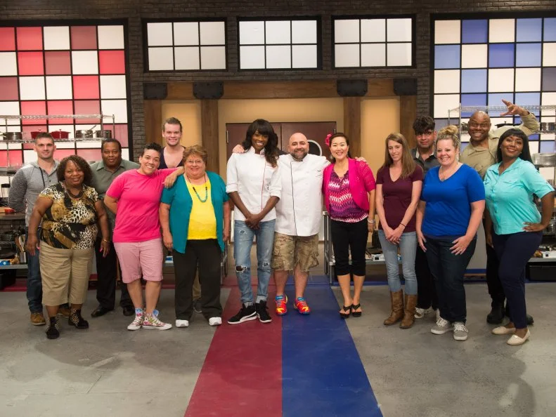 Hosts Duff Goldman and Lorraine Pascale with competitors (left to right) Ryan Neiman, Carla Johnson, Anthony Lee, Shante Randolph, Jesse Wyum, Judy Welch, Lizzy Lu, Samantha Brown, David Rosenberg, Stephanie Garcia, Carey Westbrook, and Kimberly Worthy, as seen on Food Network’s Worst Bakers In America, Season 1.
