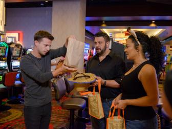 Magician Mat Franco (L) preforms a halloween magic trick for Travel Channel's Adam Richman (C) and HGTV's Egypt Sherrod (R) at the Linq Hotel and Casino, as seen during the 2016 All Star Halloween Spectacular. (action)