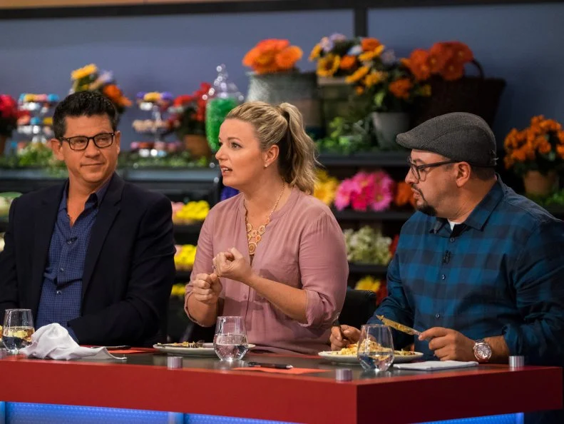 Judge Damaris Phillips speaks to contestants, as seen on Food Network's Guy's Grocery Games, Season 12.