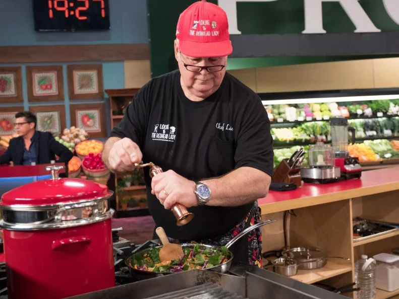 Contestant Louie Finnan prepares his dish, as seen on Food Network's Guy's Grocery Games, Season 12.