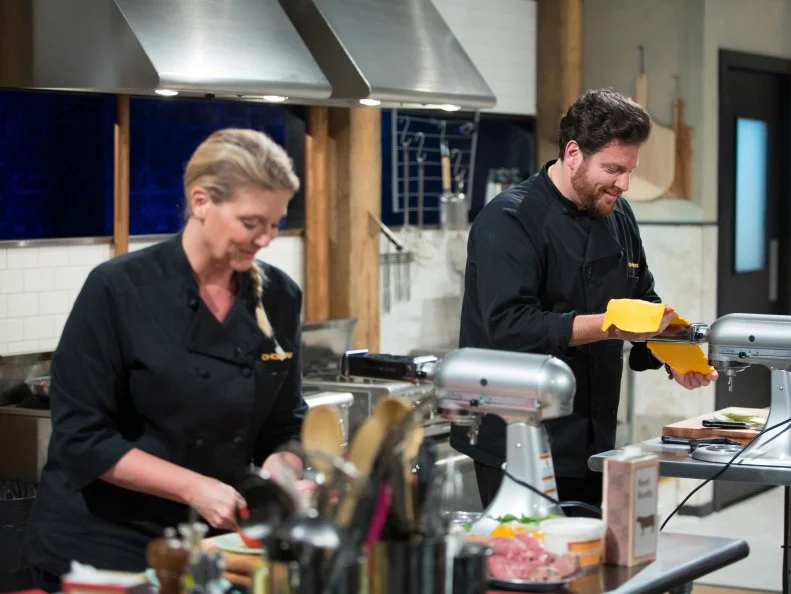 Judges Amanda Freitag (L) and Scott Conant cook during the entrŽe round, Noodles, as seen on Food Network's Chopped After Hours, Season 32.
