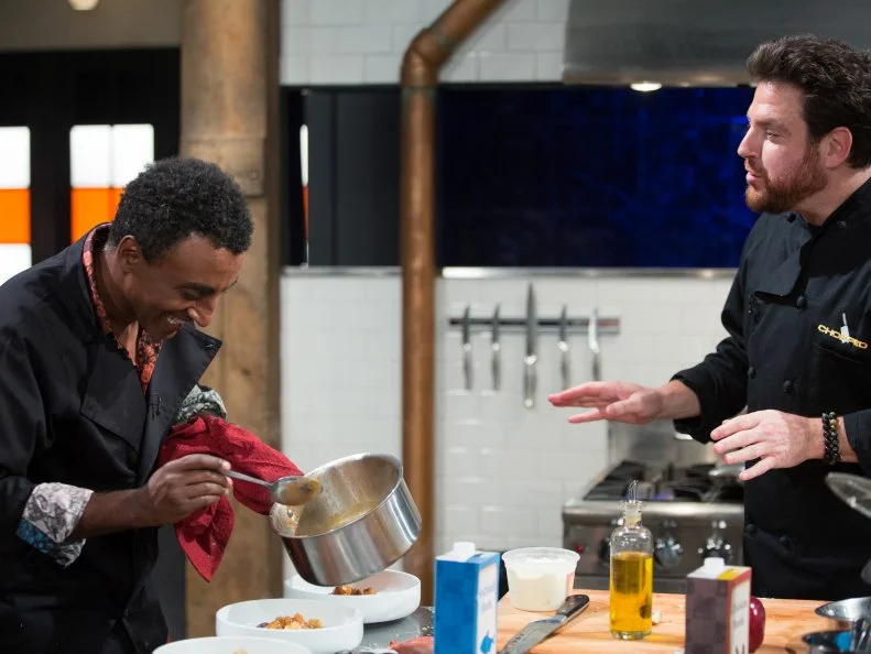 Judges Marcus Samuelsson (L) and Scott Conant during the entrŽe round, Noodles, as seen on Food Network's Chopped After Hours, Season 32.