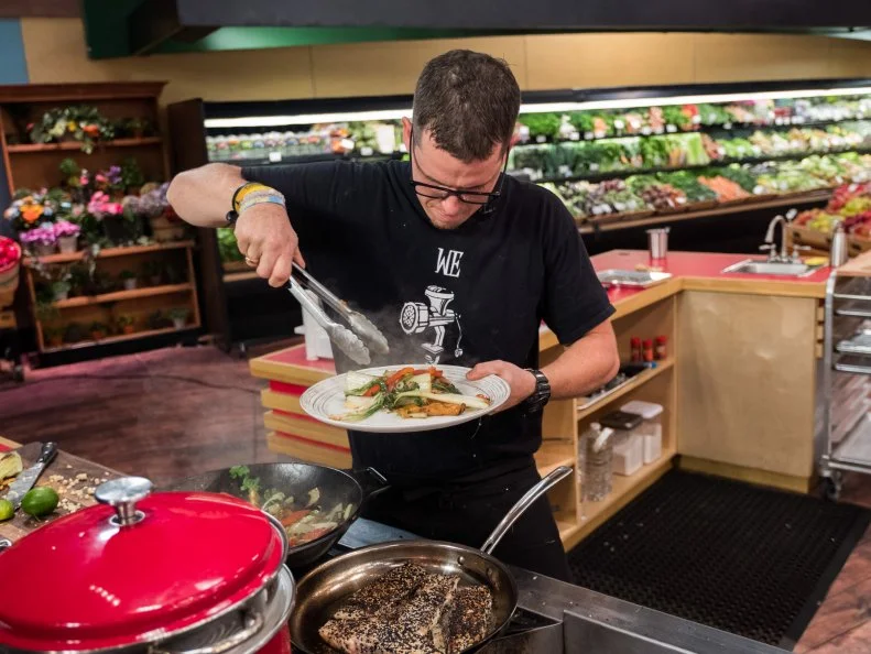 Contestant Bobby Marcotte plates his dish, as seen on Food Network's Guy's Grocery Games, Season 12.