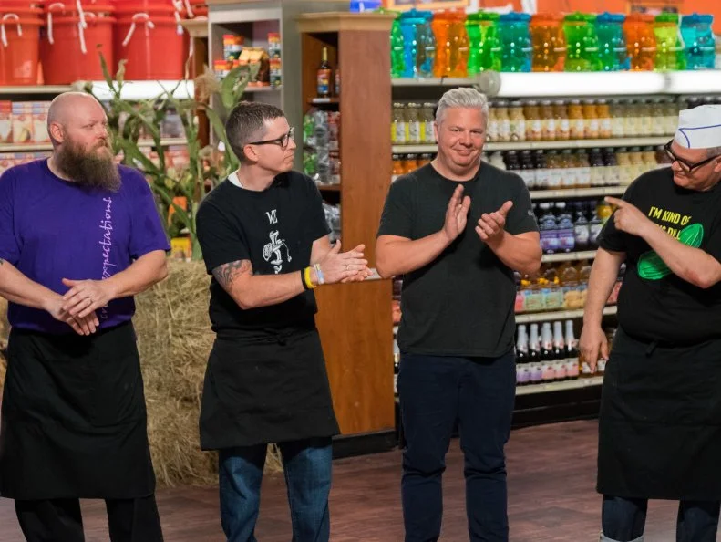 Contestants Louis Remillard, Bobby Marcotte, Adam Sappington and Zane Caplansky wait for the judges to critique their dishes, as seen on Food Network's Guy's Grocery Games, Season 12.