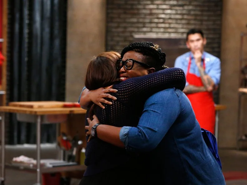 Ann Odogwu of the blue team hugs mentor Rachael Ray after being eliminated, as seen on Food Network's Worst Cooks in America, Season 10.