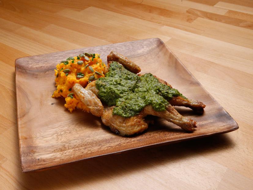 Mentor Rachael Ray's Spatchcocked and Roasted Cornish Game Hen with Green Mojo dish is displayed, as seen on Food Network's Worst Cooks in America, Season 10.