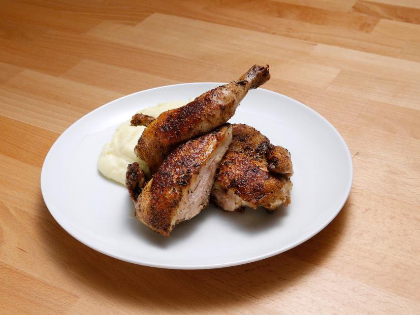 Mentor Anne Burrell's Spatchcocked and Roasted Cornish Game Hen with Mashed Yukon Gold Potatoes dish is displayed, as seen on Food Network's Worst Cooks in America, Season 10.