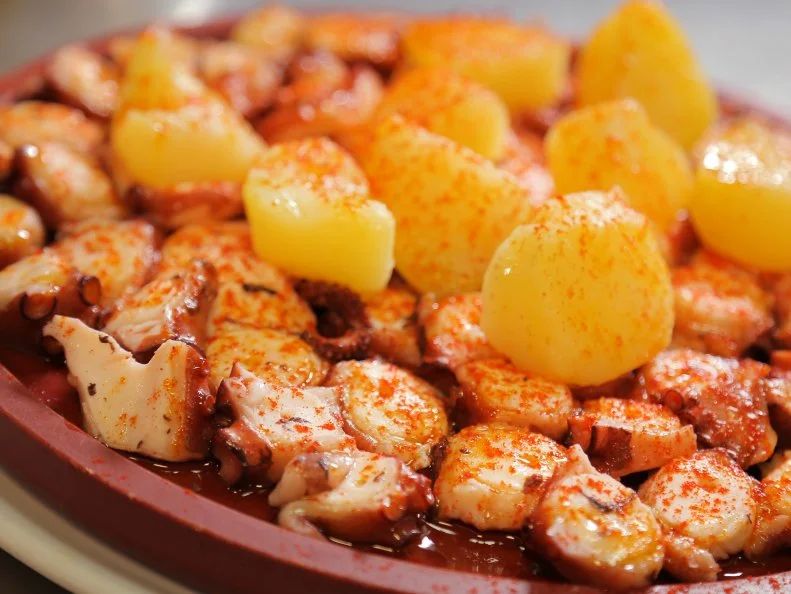 Galician Style Octopus as served at Pulperia a Gudina in Barcelona, Spain as seen on Food Network's Diners, Drive-Ins and Dives episode 2602.