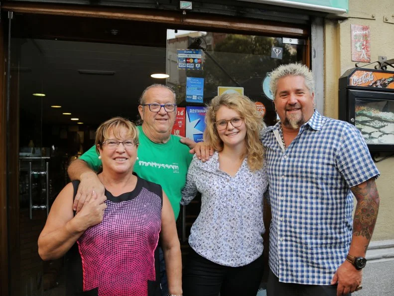 Host Guy Fieri, Chef and Owner Pedro Sausor, wife, and Daughter-in-Law Carolyn Bradford at Bar Morrysom in Barcelona, Spain as seen on Food Network's Diners, Drive-Ins and Dives episode 2602.