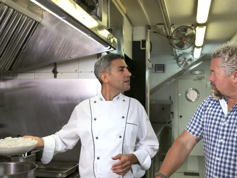 Host Guy Fieri and Chef Ramiro Rodriguez at El Pacifico in Barcelona, Spain as seen on Food Network's Diners, Drive-Ins and Dives episode 2601.