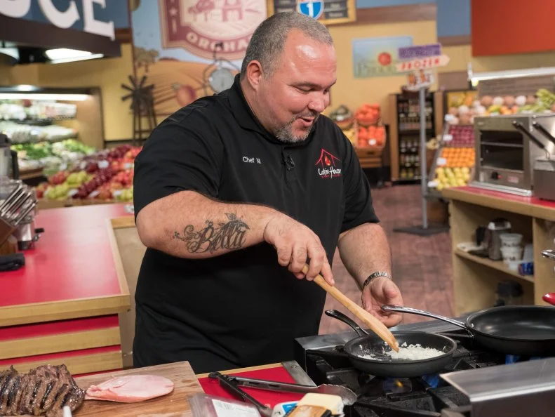 Contestant Michell Sanchez prepares his dish, as seen on Food Network's Guy's Grocery Games, Season 12.