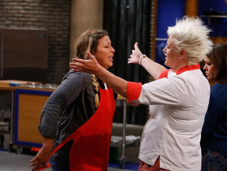 Kayla Kurtz of the red team reacts with mentor Anne Burrell as she is eliminated from the red team, as seen on Food Network's Worst Cooks in America, Season 10.