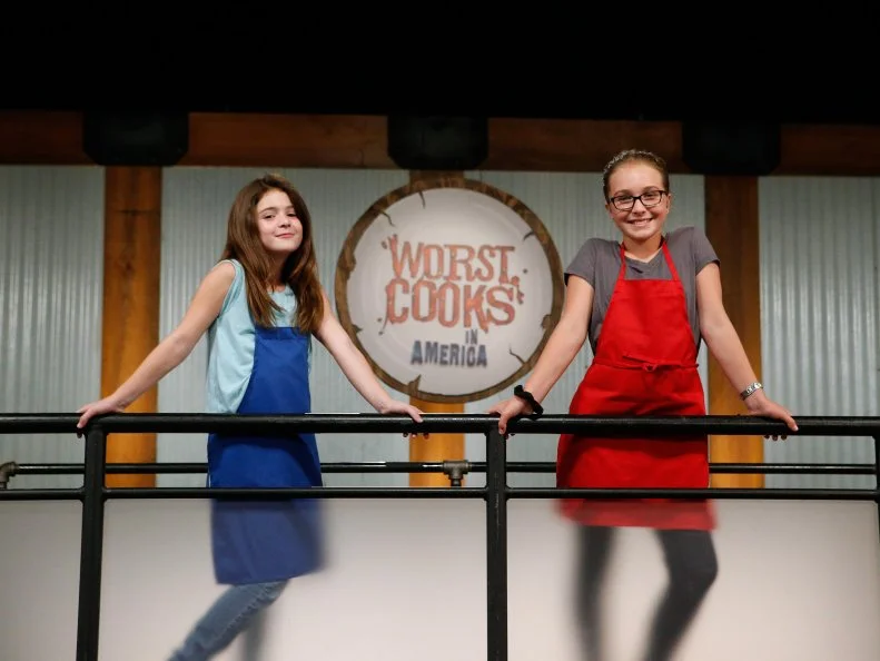 Guest mentors Lexi Shuster and Isabella Uzcategui pose together, as seen on Food Network's Worst Cooks in America, Season 10.