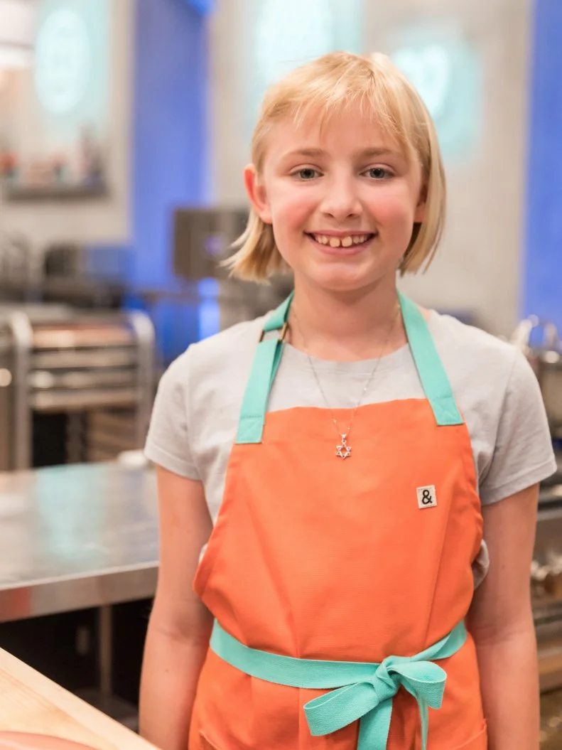 Contestant Beverly Hepler poses for a photo in the main heat, as seen on Food Network's Kids Baking Championship Season 4