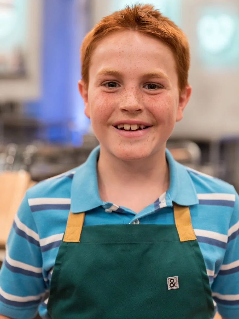 Contestant Gareth Bennett poses for a photo in the main heat, as seen on Food Network's Kids Baking Championship Season 4