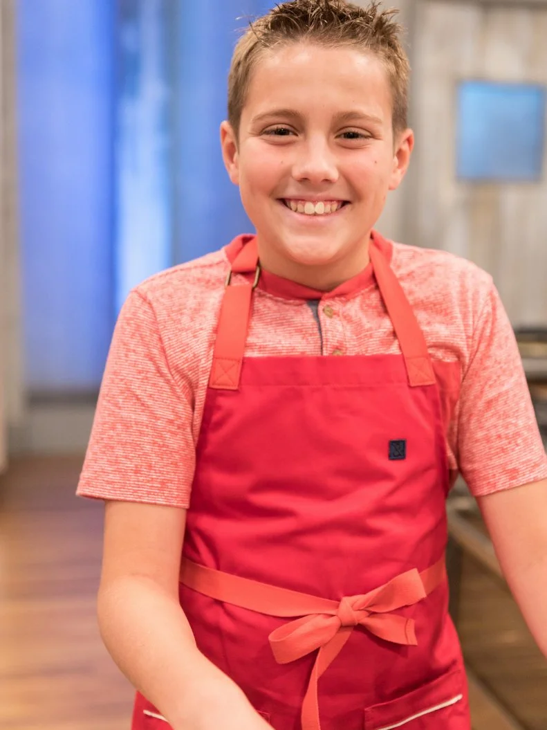 Contestnat Grady Holloway poses for a photo in the main heat, as seen on Food Network's Kids Baking Championship Season 4