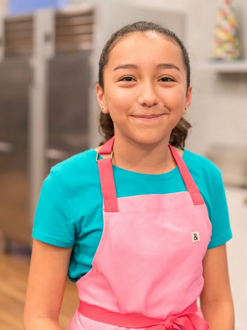 Contestant Julia Betz poses for a photo in the main heat, as seen on Food Network's Kids Baking Championship Season 4