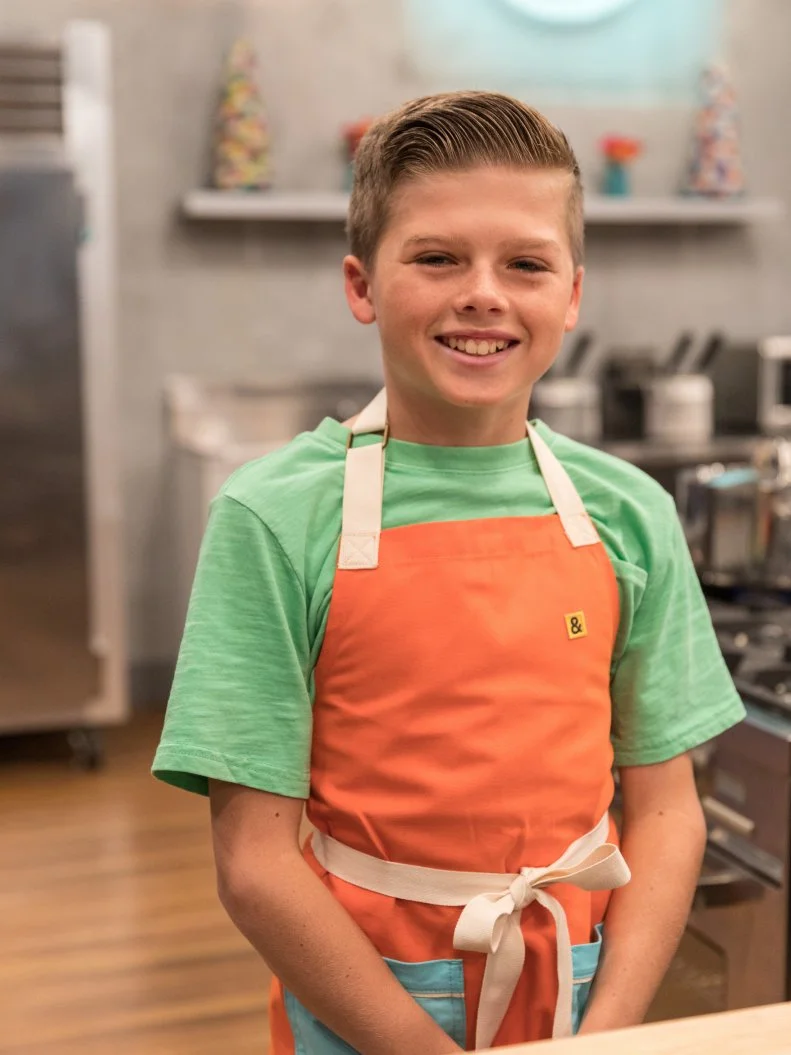 Contestant Luke Jonsson poses for a photo in the main heat, as seen on Food Network's Kids Baking Championship Season 4