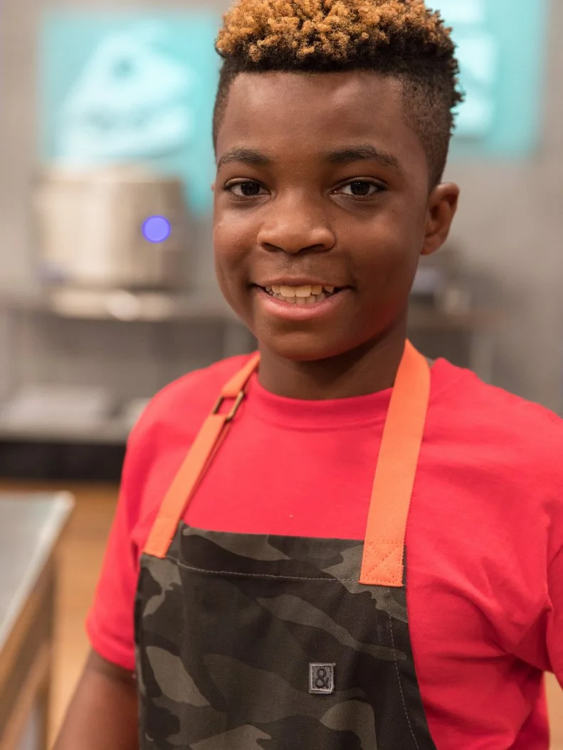 Contestant Michale Platt poses for a photo in the main heat, as seen on Food Network's Kids Baking Championship Season 4