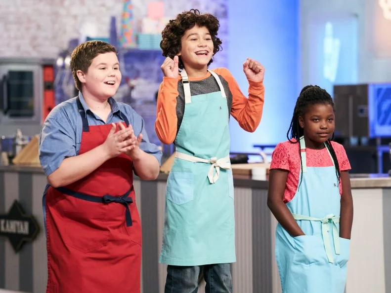 Contestants Aidan Berry, Cole Kaniyah Cary and Justice Faustina during elimination, as seen on Food Network's Kids Baking Championship, Season 3.